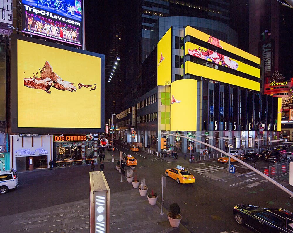 Mountain Light Time across multiple Times Square billboards.